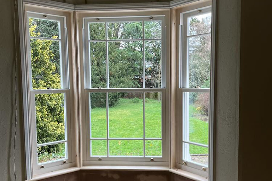 White sliding sash bay windows