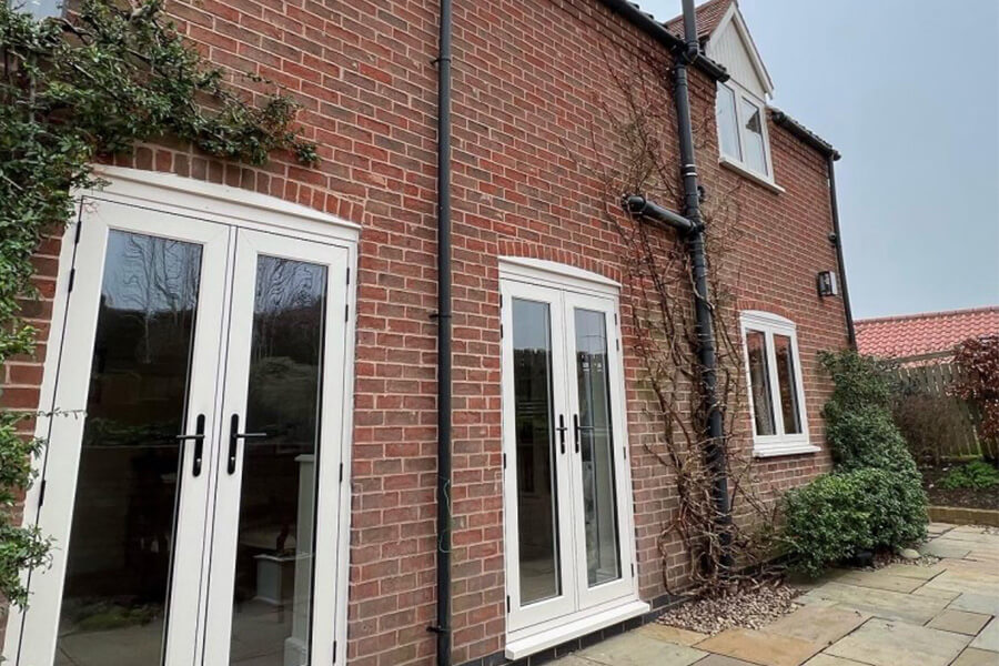 White French doors and casement windows