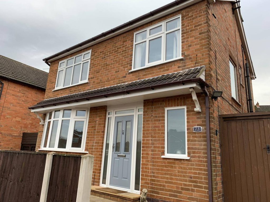 composite front door with white upvc windows