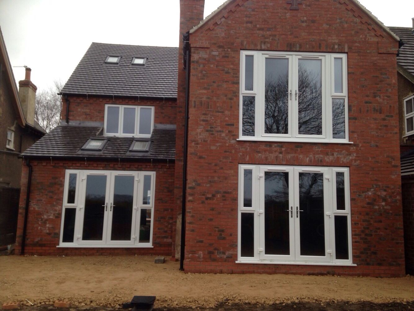 three sets of white uPVC French Doors