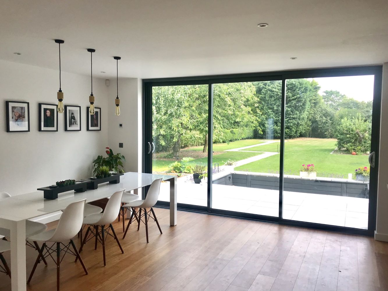 internal view of sliding patio doors leading out to a large garden