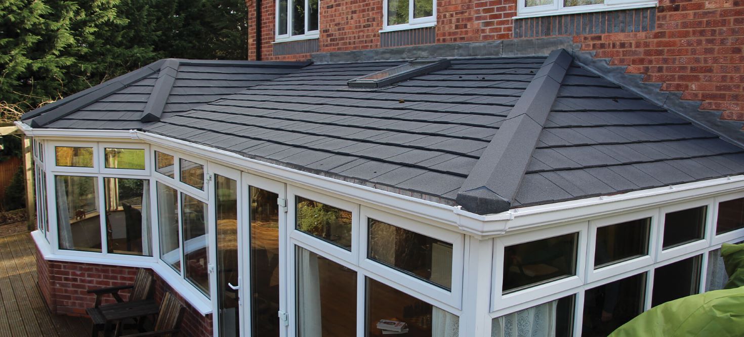 tiled roof on white upvc conservatory